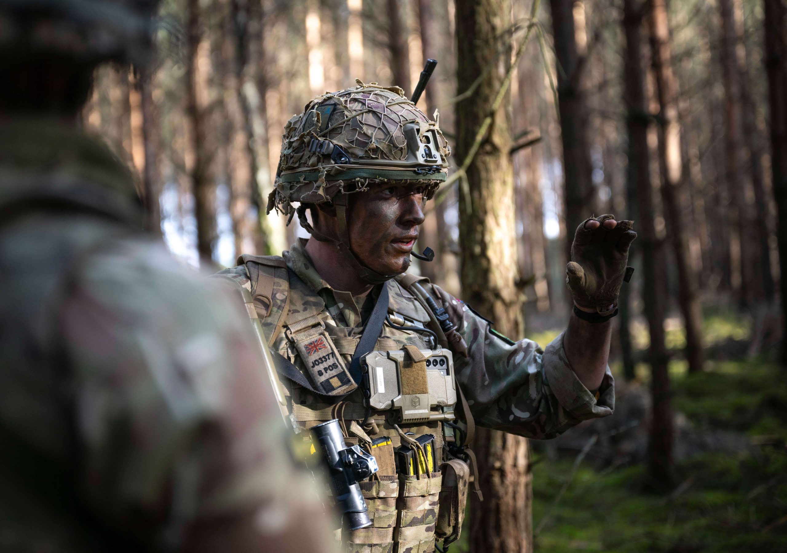 military member in the woods